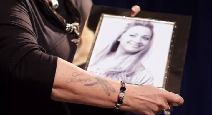 Deborah Carlin Polhill of Cortlandt Manor holds a photo of her late daughter, Cait Chivonne Polhill, who died in 2011 at age 28.