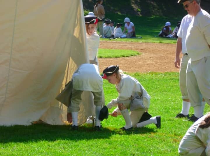 Students from Pleasantvilles Bedford Road School pitch a tent during Revolutionary War re-enactment.