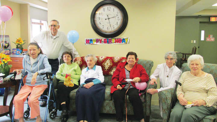 Peligrina (Pal) DeLuca celebrates her 105th birthday with friends at the Adult Day Care Center at Fieldhome..