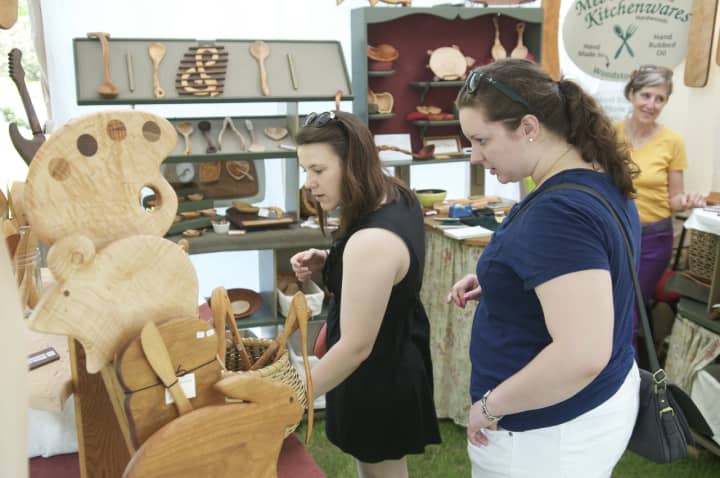 Festival-goers check out a kitchenware display at the Outdoor Crafts Festival last year at the Bruce Museum in Greenwich.