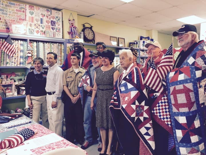 Connecticut Quilts of Valor presents quilts to eight area veterans.