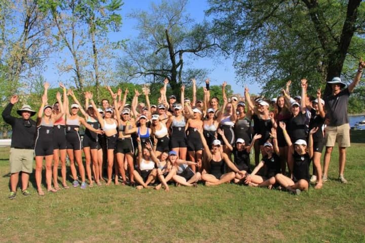 The Saugatuck Rowing Club girls team celebrating after the Northeast regional regatta last weekend with head coach Chase Graham and assistant coach Gordon Getsinger.