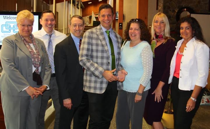 Antony Stirpe, center, pictured with administrators and other staff from the New Rochelle Schools