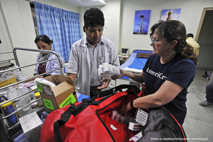 Dr. E. Anne Peterson of AmeriCares delivers medicine to the Nepal Cleft &amp; Burn Center on April 29.