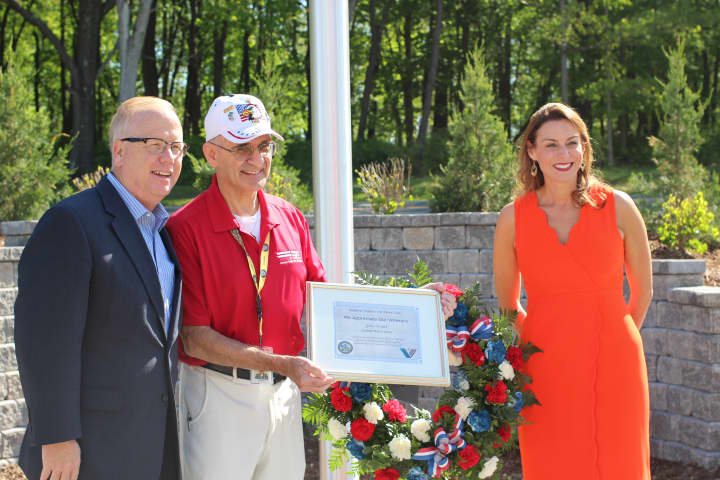 From left, Danbury Mayor Mark Boughton, Regional Hospice volunteer Gary Boulet, and Cynthia Rot, Regional Hospice and Home Care chief executive officer, at the ceremony in appreciation of Boulets military service in honor of Memorial Day.