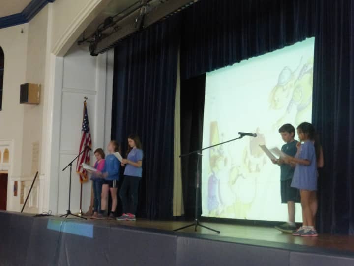 Katonah Elementary School fifth-graders read the book Michael Recycle to their classmates as they reflected on Earth Day.