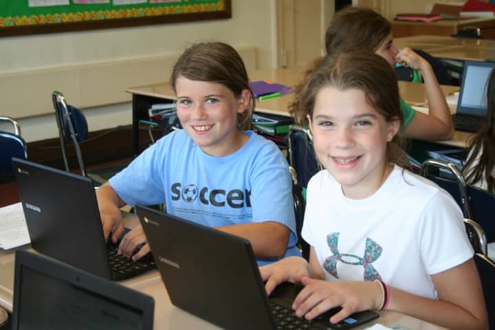 Bronxville students Ava Black and Mae Thomas working with Chromebooks and Google Apps for Education.