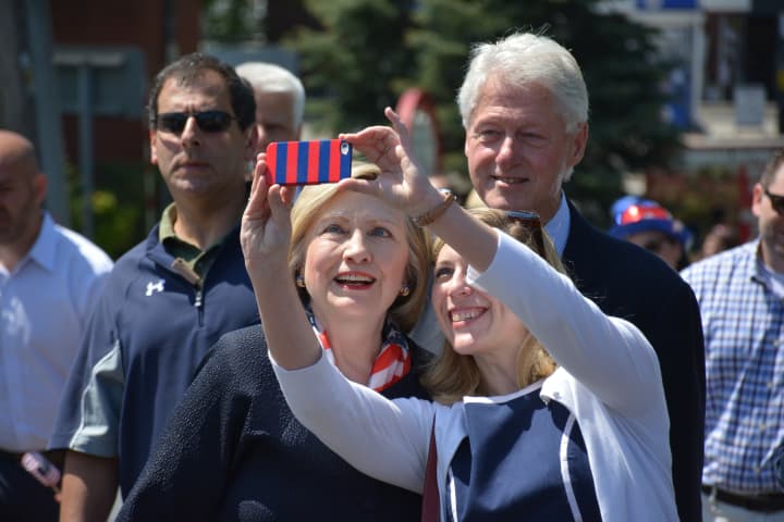 Bill and Hillary Clinton pause for what looks like a selfie attempt at the Chappaqua Memorial Day parade in May.