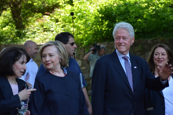 Hillary and Bill Clinton march in New Castle&#x27;s Memorial Day parade. Town Councilwoman Elise Kessler Motte(left) and Deputy Supervisor Lisa Katz (right) march with them
