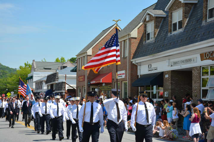 Local firefighters march in New Castle&#x27;s Memorial Day parade, which was held on Monday in downtown Chappaqua.
