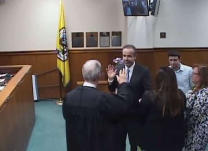 New Tuckahoe Trustee Antonio Leo being sworn into his new office.