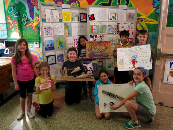 Student-artists proudly displayed their work at an art show at Main Street School. 