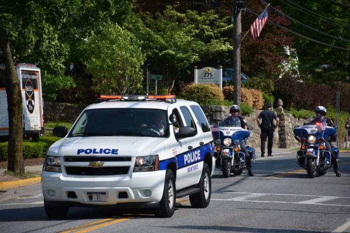 A Mount Kisco police vehicle leads the procession for the local Memorial Day parade.