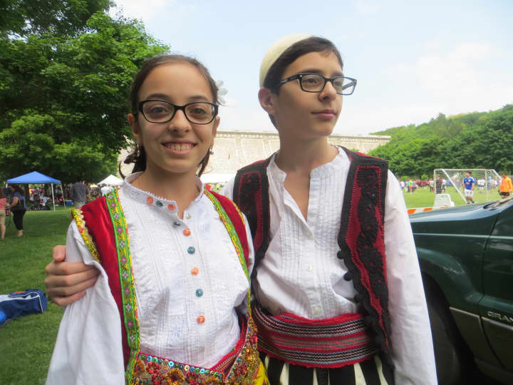 Elisa and Denis Qehaja, sixth grade twins, were among the youths from Our Lady of Shkodra Church in Hartsdale preparing to dance at Kensico Dam Plaza before thunderstorms rolled in on Sunday.