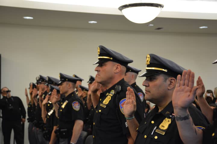 Former Mount Kisco Police Department members are sworn in as Westchester County police.