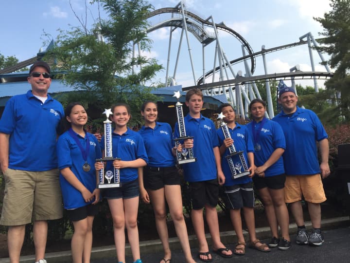 Lindsey Co, Port Chester Middle School Band President Isabel Sanchez, PCMS Chorus President Isabella Ramos, Chorus Vice President Kyle Baxter, Band Vice President Eli Taylor-Lemire and Isabella Rios, with trophies won in the competition.  