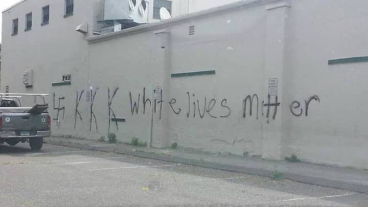 A swastika, KKK and the phrase &quot;white lives matter&quot; is spray-painted on the side of a vacant building at 1280 Stratfield Road in Fairfield. 