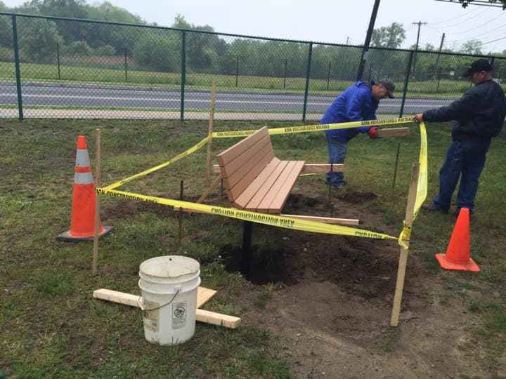 Harrison Department of Public Works employees installed benches donated to iHeartHarrison at the renovated Wilding Park this week. 