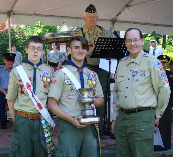 Pictured with the Harrington Cup for Advancement are Troop 2 Chairperson Edward Mann and Scouts Aidan Connolly, far left, and Eddie Gruber.
