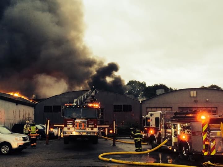 Warehouses at the former yard of Fairfield Lumber burn late Tuesday.