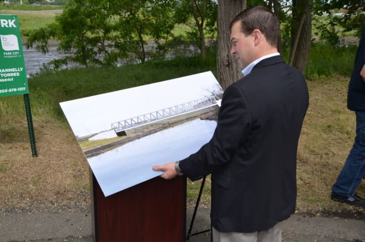 Rep. Stafstrom with the mockup of the future bridge.