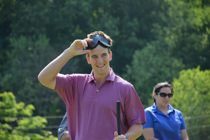 Eli Manning, pictured just after finishing at putting demonstration at the Mount Kisco Country Club.