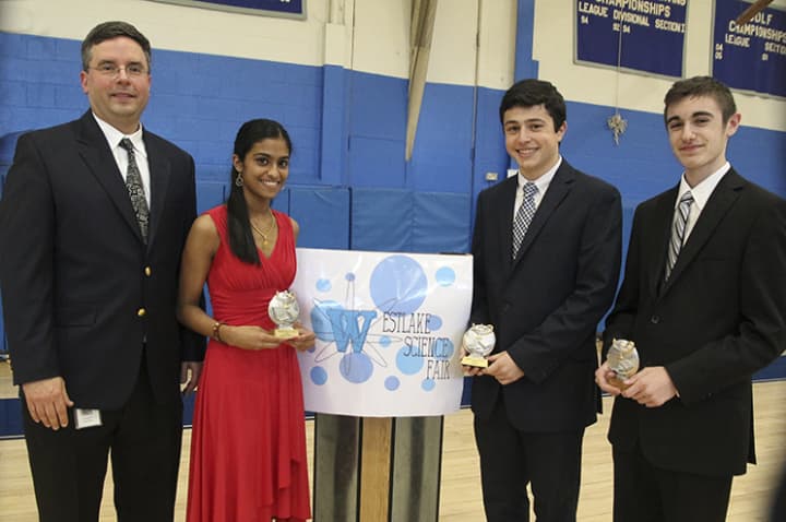 From left, Lawrence McIntyre, science research teacher and Westlake Science Fair organizer, with Westlake students and award winners Meenu Mundackal, Peter Psaltakis, and Ryan Stasolla.