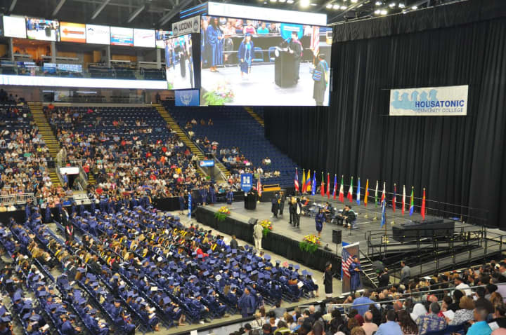 Clad in their dark blue caps and gowns, 601 Housatonic Community College students ascended the stage at the Webster Bank Arena at Harbor Yard to receive their degrees and certificates at the colleges 48th commencement.