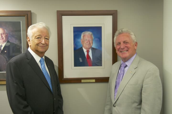 Norwalk Mayor Harry Rilling (right) and former Mayor Richard A. Moccia in front of Moccia&#x27;s official portrait.
