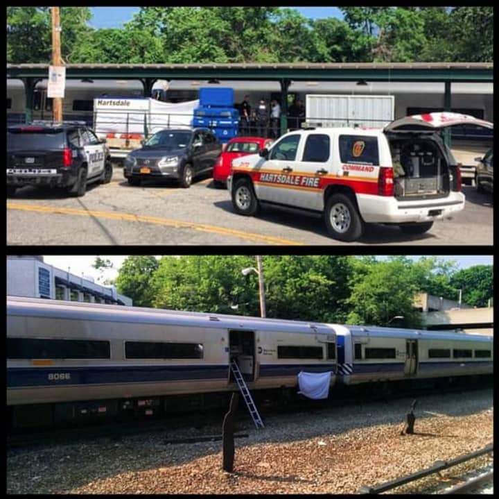 Police responding to the scene in Hartsdale after a man was struck by a train. 