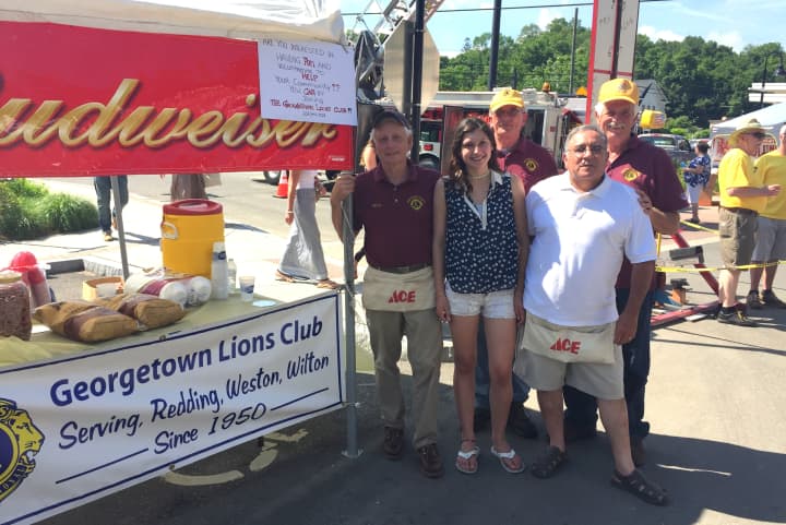Members of the Georgetown Lions Club man the beer tent at the 13th annual Georgetown Day.
