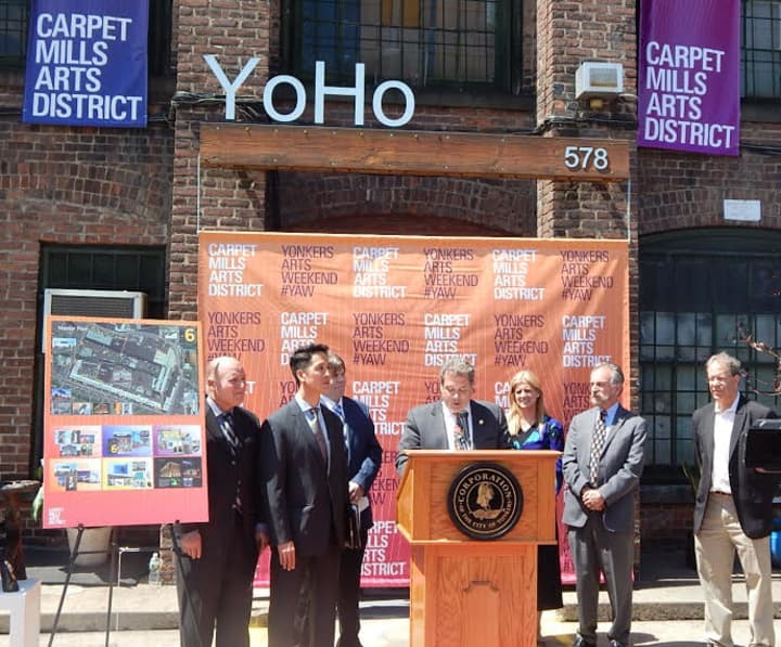 Yonkers Mayor Mike Spano announces the renaming of the Alexander Smith Carpet Mills as the Carpet Mills Arts District last year. The city has just approved zoning which will allow its warehouses to be converted into shops, galleries, and restaurants.