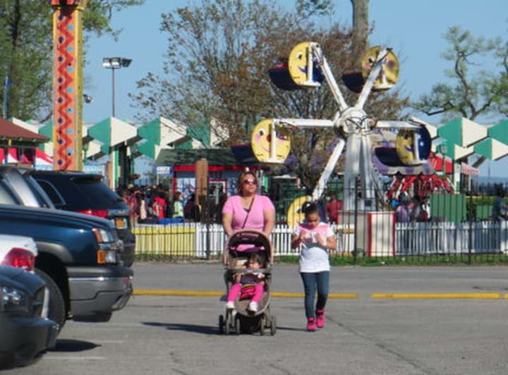 A mother and her two children leave Playland Amusement Park on opening weekend in May 2014.