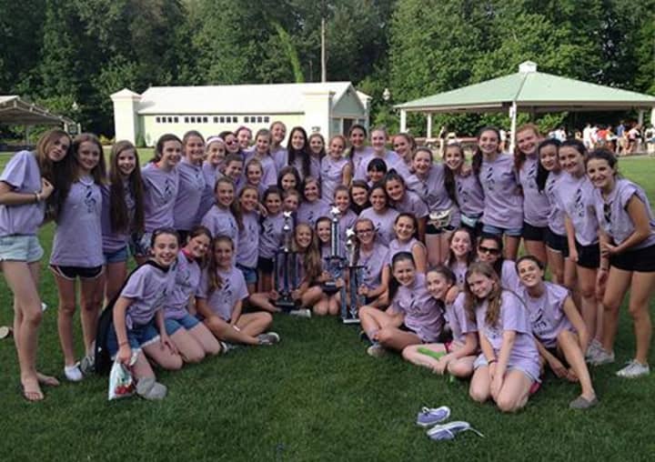 Saxe eighth grade girls Treble Ensemble with their trophy from the Music in the Parks Festival.
