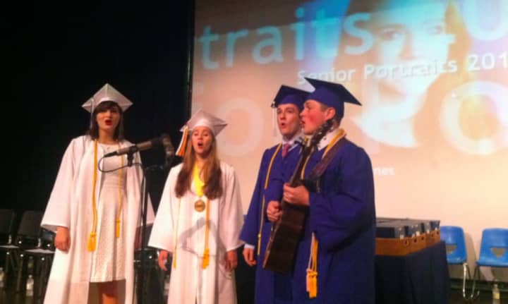 A group of graduates prepare their song before the Darien High School graduation ceremonies in 2015.