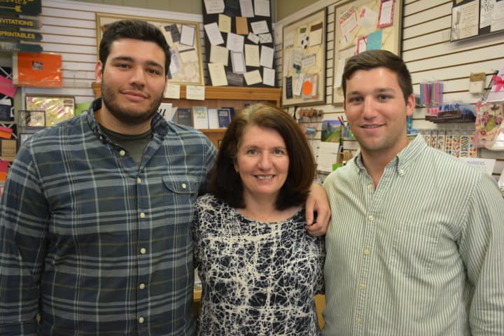 Fine Lines owner Laura Marks (center) with her sons, Alex (left) and David (right).
