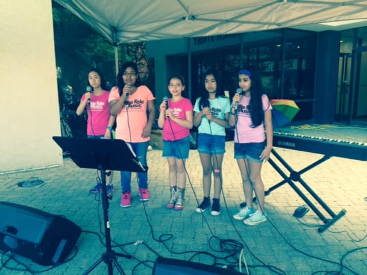Students from the rock star vocal workshop perform at Ossining VillageFair. The girls -- Caleigh, Christina, Eden, Ella and Ariana, who come from Ossining, Briarcliff and Chappaqua -- sang two songs. They have been working on pop/rock voc