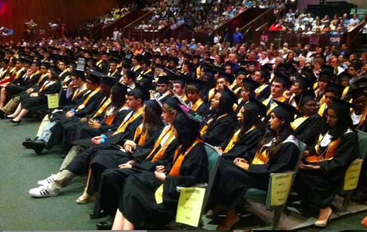 Students at the Academy of Information Technology &amp; Engineering sit during the school&#x27;s graduation ceremony in 2015.