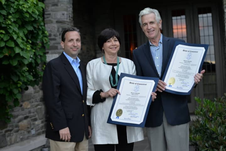 Sen. Bob Duff, D-Norwalk/Darien, presents Elisabeth Morten and James Naughton with citations honoring their work in the arts at a benefit in Fairfield on June 5.