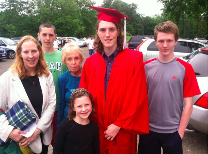 Eamon Cartine is surrounded by family just before the graduation ceremony. From left: mother Kathleen, brother Kevin, 14, grandmother Mary Lynch, sister Julie Ann, 7, and brother Peter, 15. Missing from photo is his father Greg.