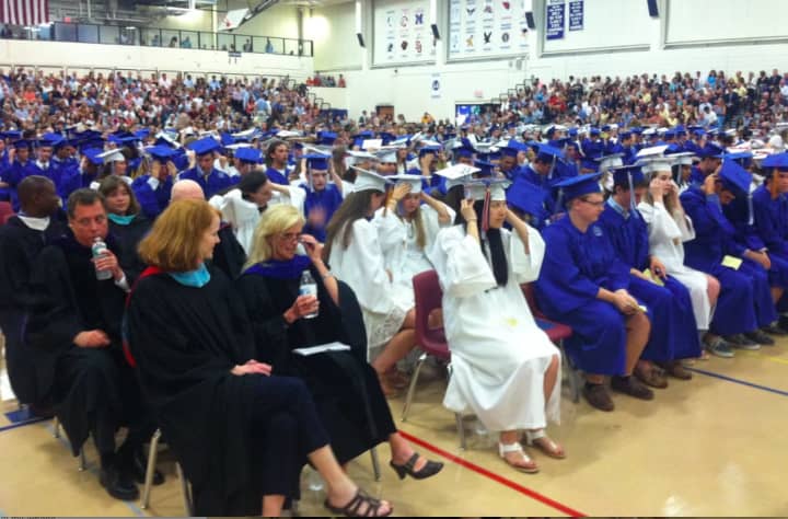 Graduates and special guests wait for the Wilton High School graduation ceremonies to begin last year. This year&#x27;s graduation will be held Saturday.