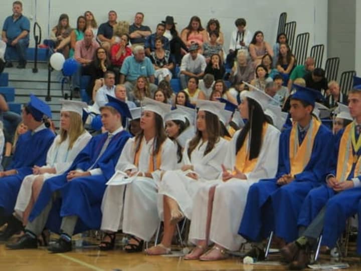 Some of the Class of 2015 graduates at Dobbs Ferry High School listening to Sasha Clarick&#x27;s valedictorian speech on Saturday evening. 