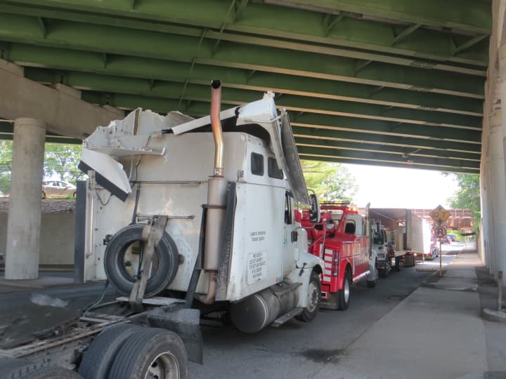 A closeup of the truck&#x27;s cab, which suffered damage to its roof when it hit a Metro-North railroad overpass in Rye on Monday.