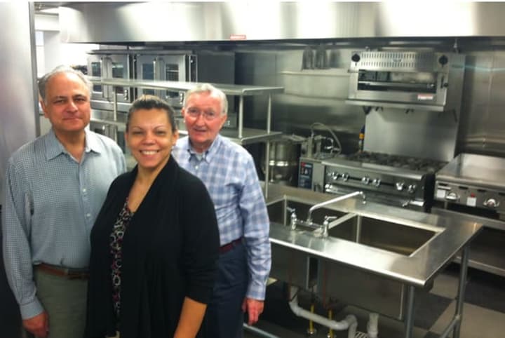 John Gutman, Betsy Lopez and Mike Boyd stand in the kitchen of New Covenant House&#x27;s new site at 174 Richmond Hill Ave. 