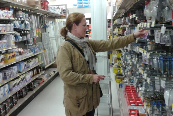 Melanie McGuire of New Canaan shops at Weed &amp; Duryea on Thursday. She knows she&#x27;ll have to get a few more supplies before Hurricane Sandy hits the area early next week. 