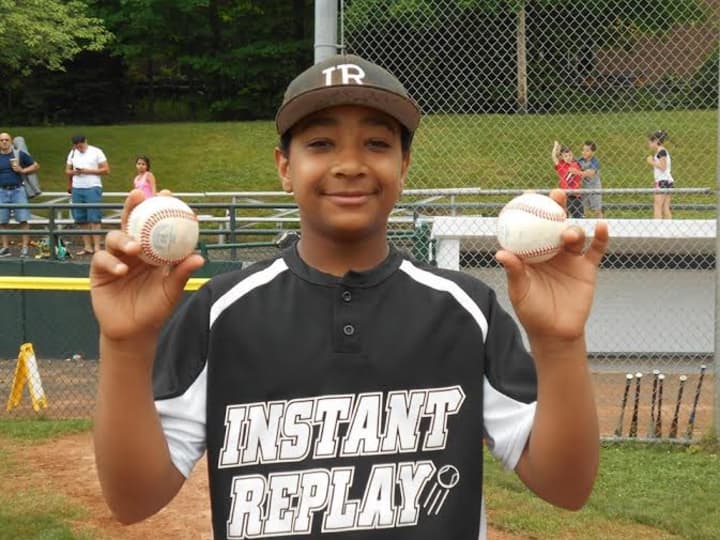 Jaden Dawkins hit two home runs for Instant Replay in its 10-0 win over RMS Construction to win the Stamford North Little League championship.