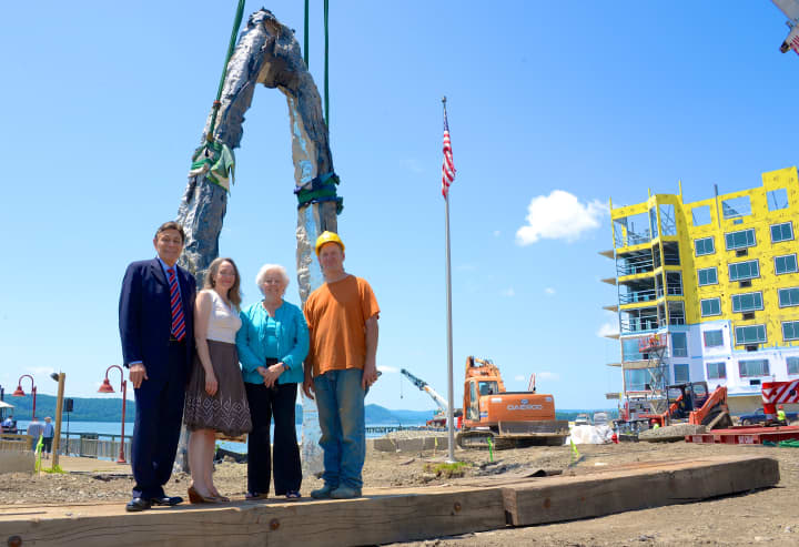 A sculpture, created by Peter Lundberg, was raised Monday at the new public waterfront park and promenade being built at Harbor Square. 