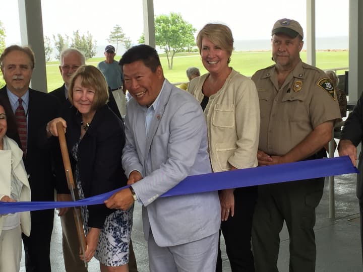 Susan Whalen, deputy commissioner of DEEP, and Tony Hwang, state senator, cut the ribbon at the pavilion at the Sherwood Island State Park Tuesday.