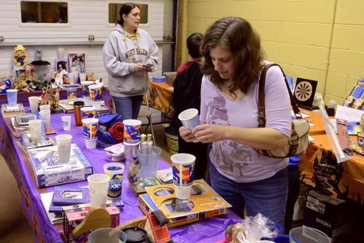 Residents peruse items at the first annual Croton Falls Fire Department Ladies Auxiliary penny social.