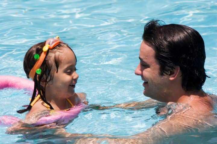The White Plains YWCA suggests adults help teach their children the importance of knowing basic swimming skills.